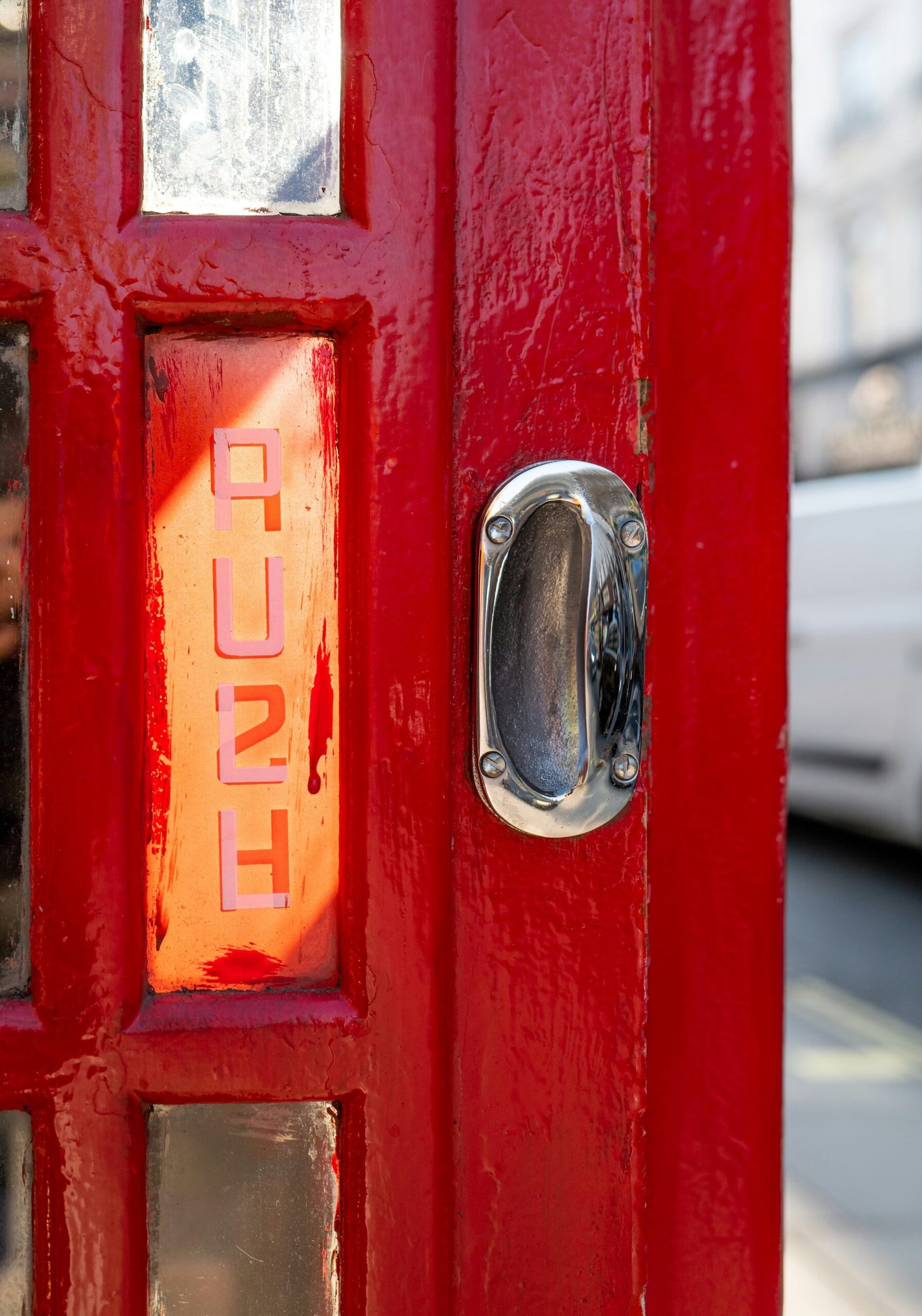 Red door with pull handle with word push